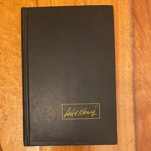 Black Hardcover Book with Gold Signature